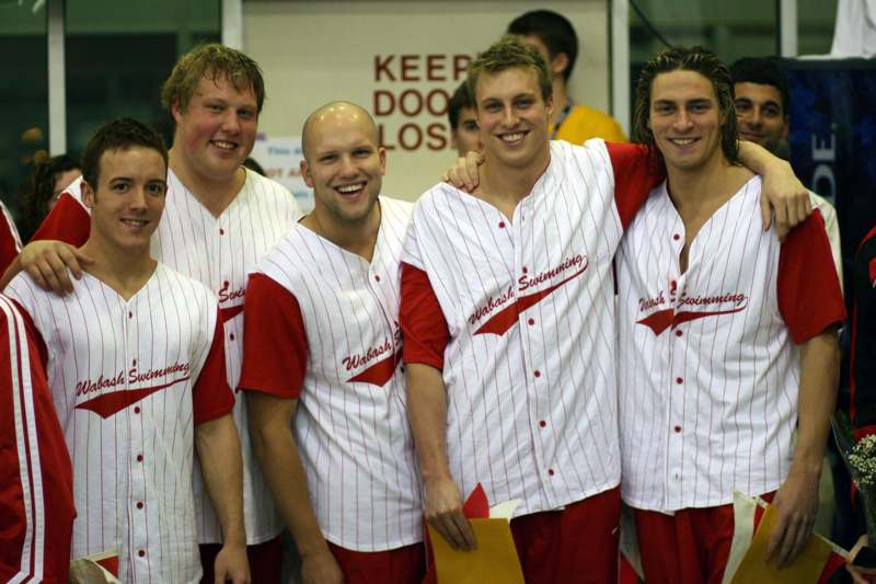a group of men wearing baseball uniforms