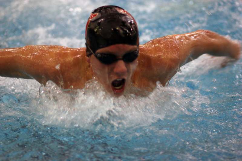 a man in a swimming cap and goggles