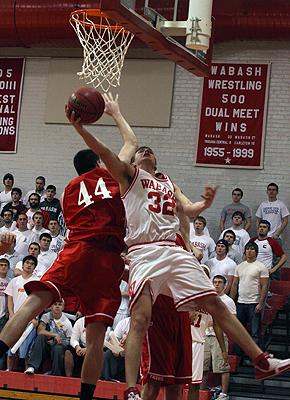 a basketball player dunking a basketball