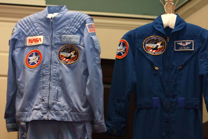 a pair of blue suits with patches