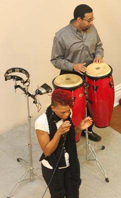 a man and woman playing drums