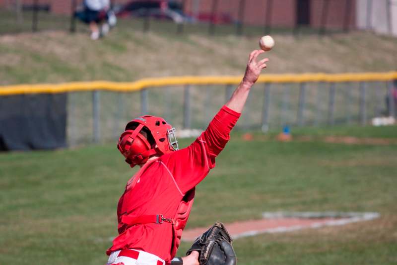 a baseball player catching a ball