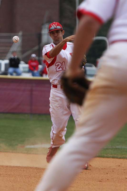 a baseball player throwing a ball