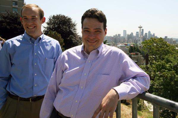 a couple of men posing for a picture