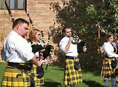 a group of people playing bagpipes