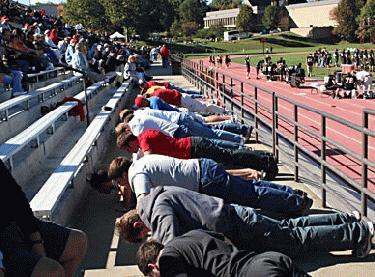 a group of people in a row on bleachers
