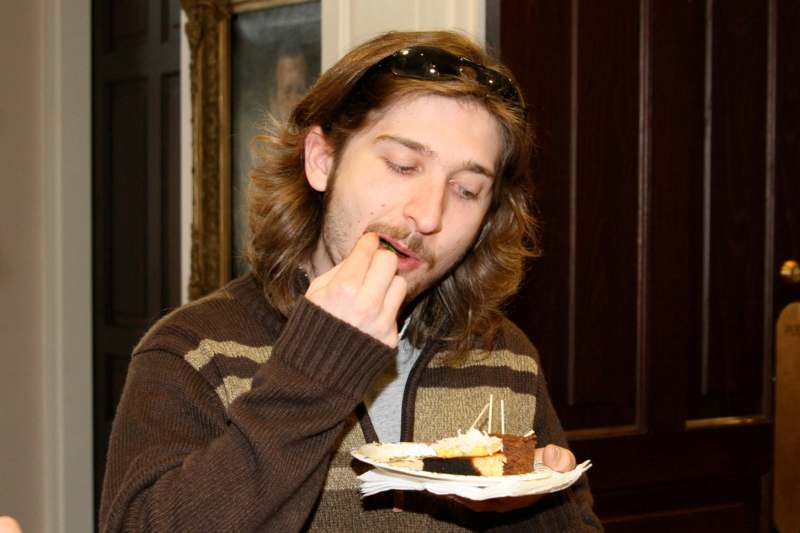a man eating a piece of cake