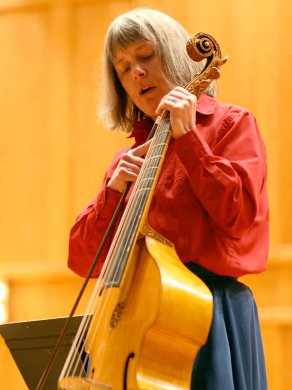 a woman playing a cello