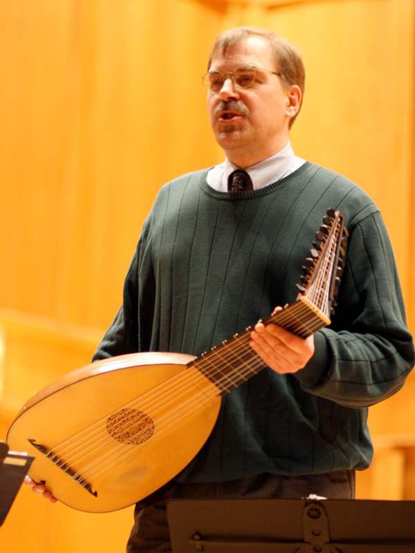 a man playing a lute