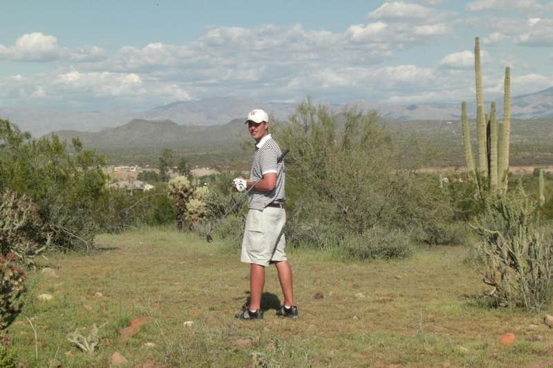 a man holding a golf club
