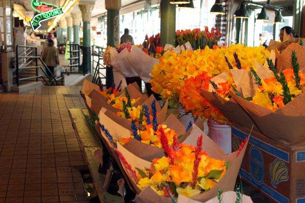 a bunch of flowers in a market