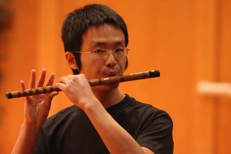 a man playing a flute