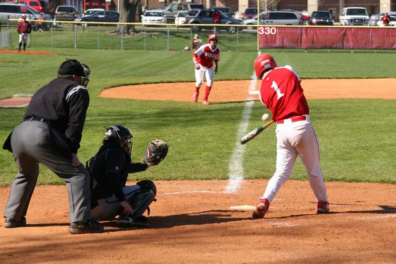 a baseball player swinging a bat