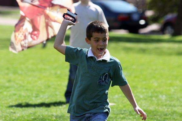 a boy running on grass