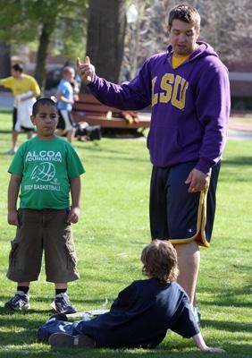 a man pointing at a child