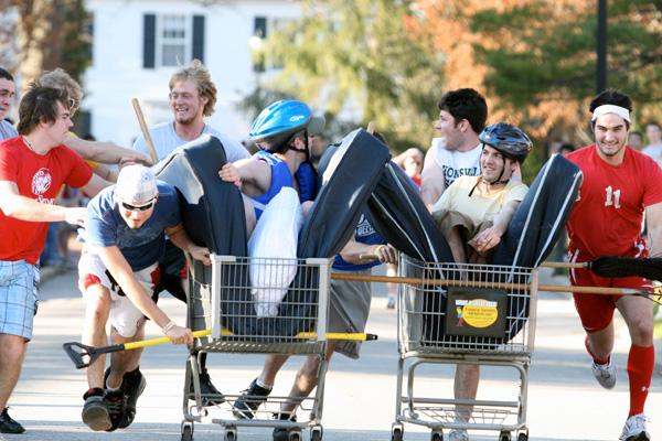 a group of people pushing shopping carts
