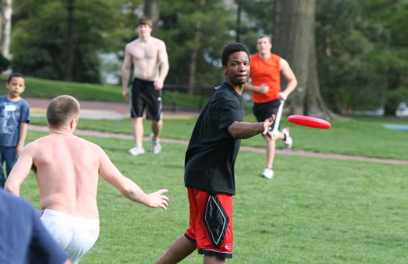 a group of men playing frisbee