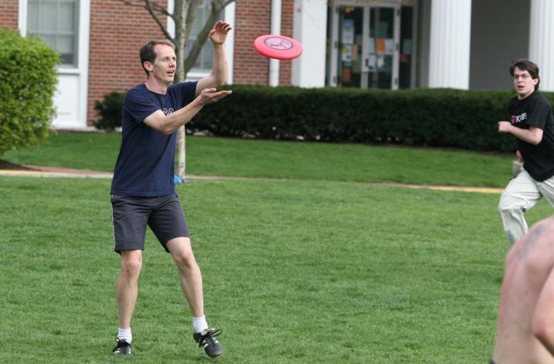 a man catching a frisbee