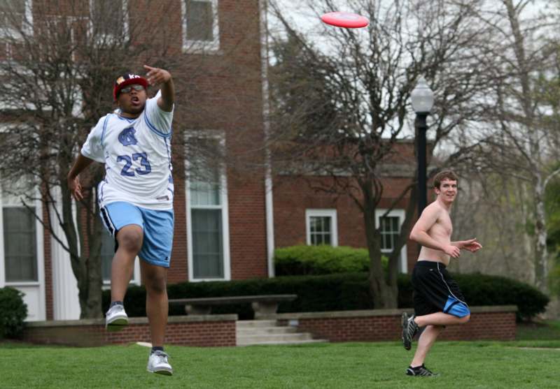 a man jumping to catch a frisbee