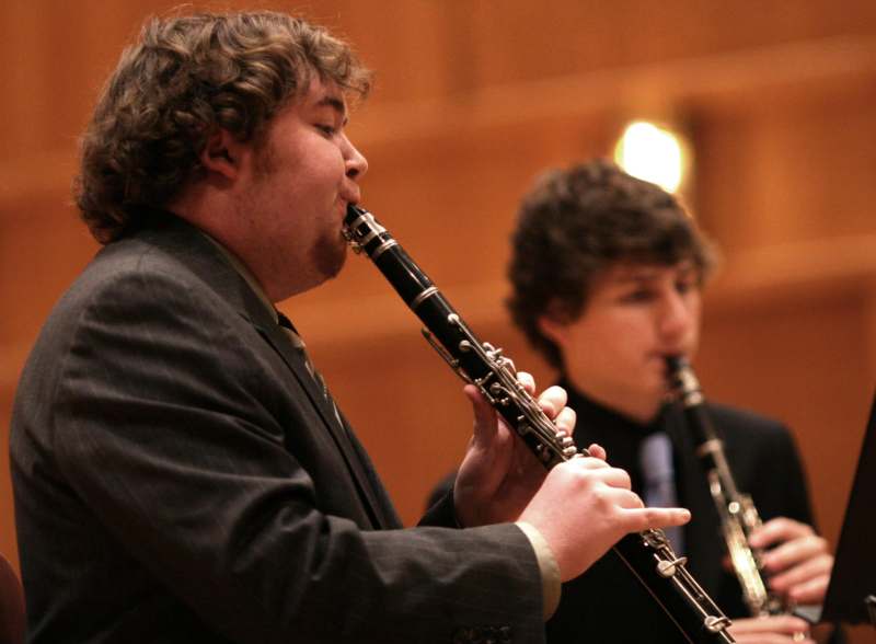 a man playing a clarinet