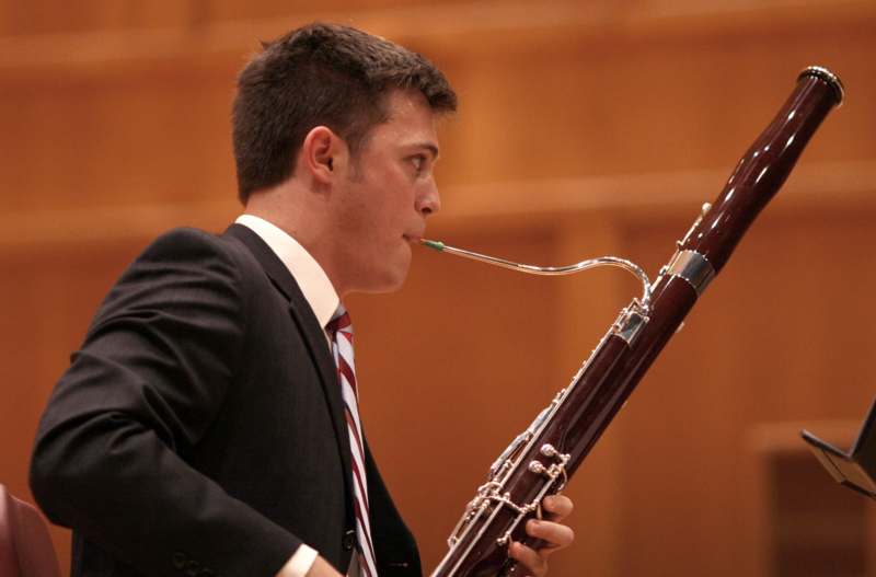 a man playing a bassoon