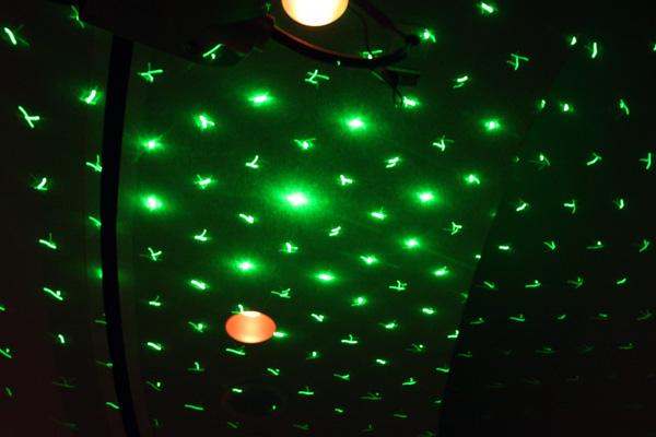 a green lights on a ceiling