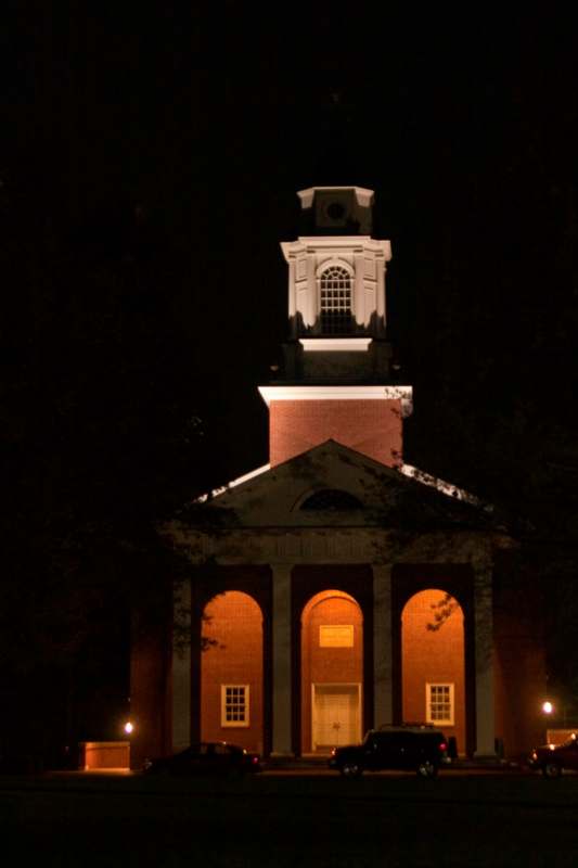a building with a tower at night