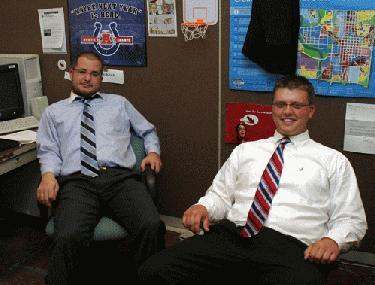 men sitting in office chairs