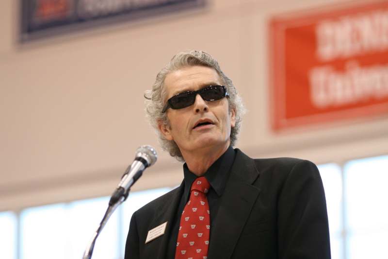 a man wearing sunglasses and a suit and tie