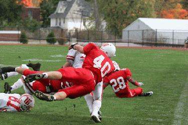 a football player falling into the ground