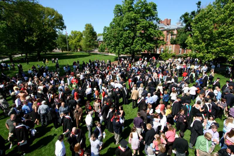 a large group of people gathered in a park