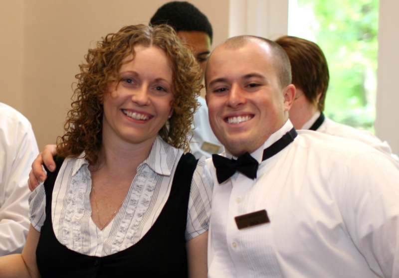 a man and woman smiling at camera