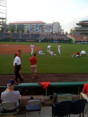 a group of people on a baseball field