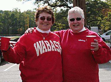 a couple of women wearing red sweaters