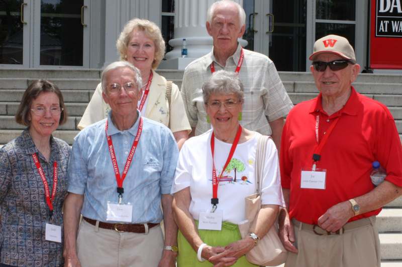 a group of older people standing together