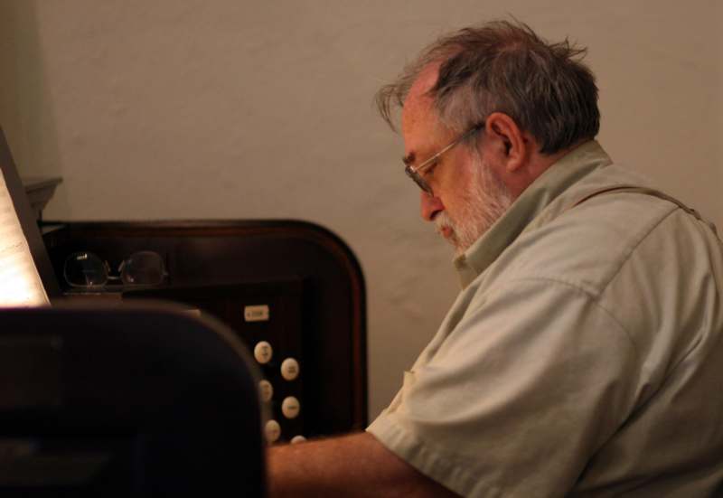 a man sitting at a piano