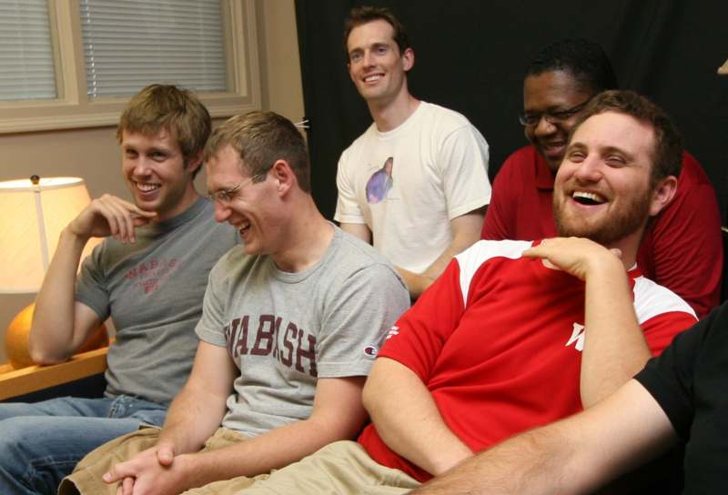 a group of men laughing