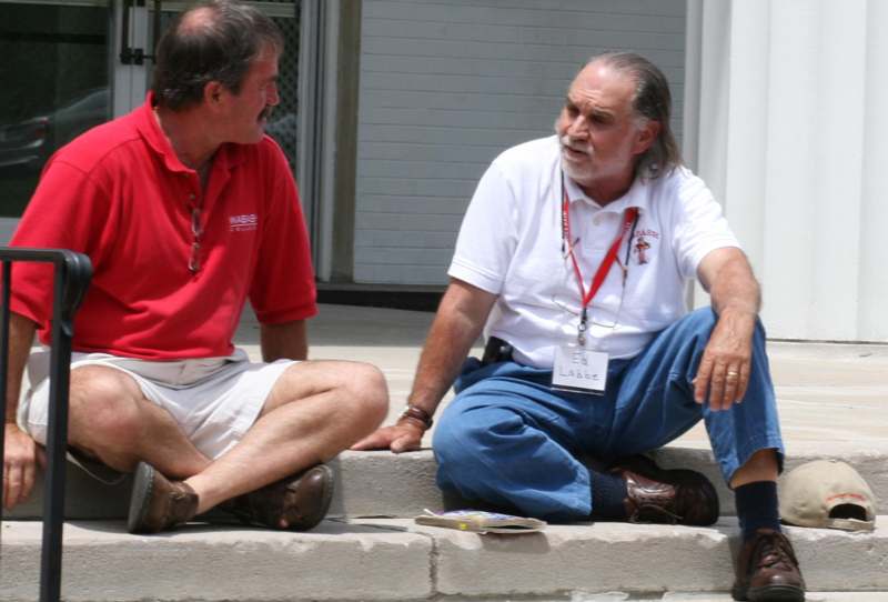 a couple of men sitting on steps