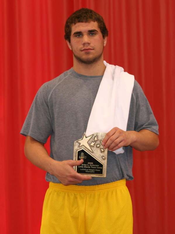 a man holding a trophy