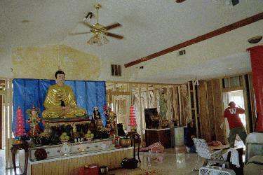 a room with a statue of a buddha