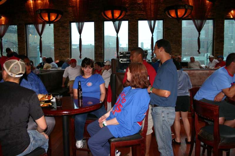 a group of people sitting at tables