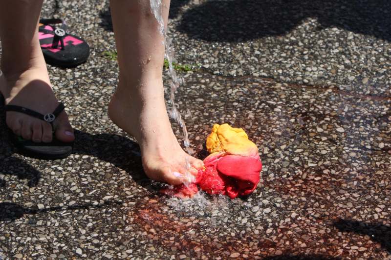 a person's foot sprinkled with water
