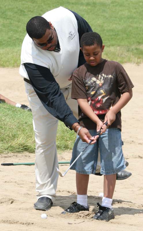 a man and boy playing golf