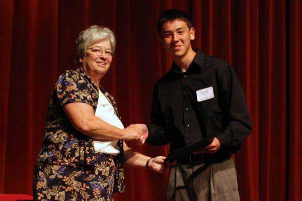 a man shaking hands with a woman