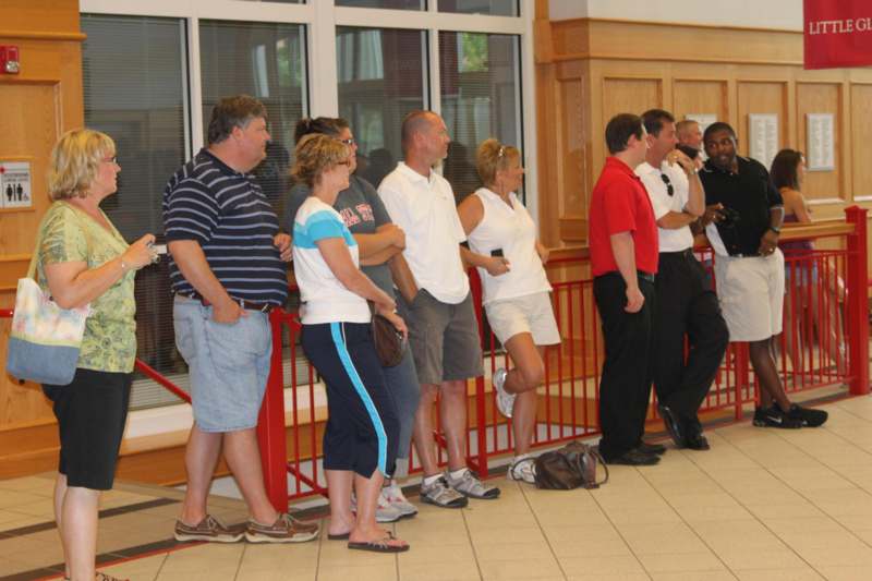 a group of people standing in a line