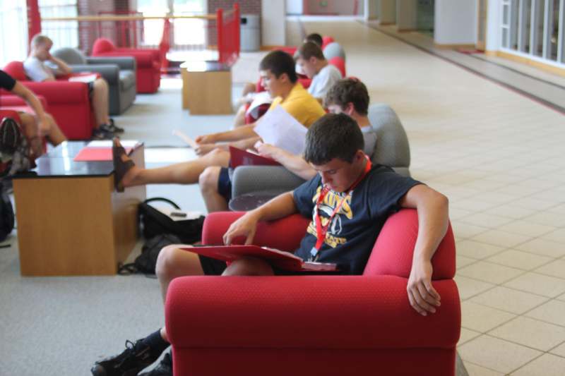 a group of people sitting in chairs