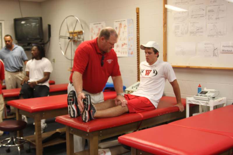 a man stretching his leg