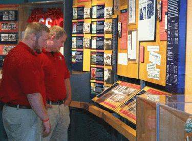 men looking at a display