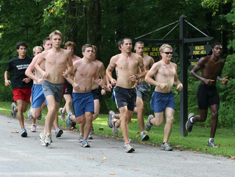 a group of people running on a road