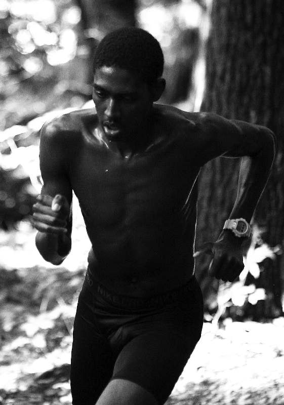a man running in the woods